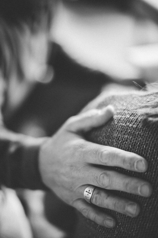 Hand with Christian ring on Shoulder small